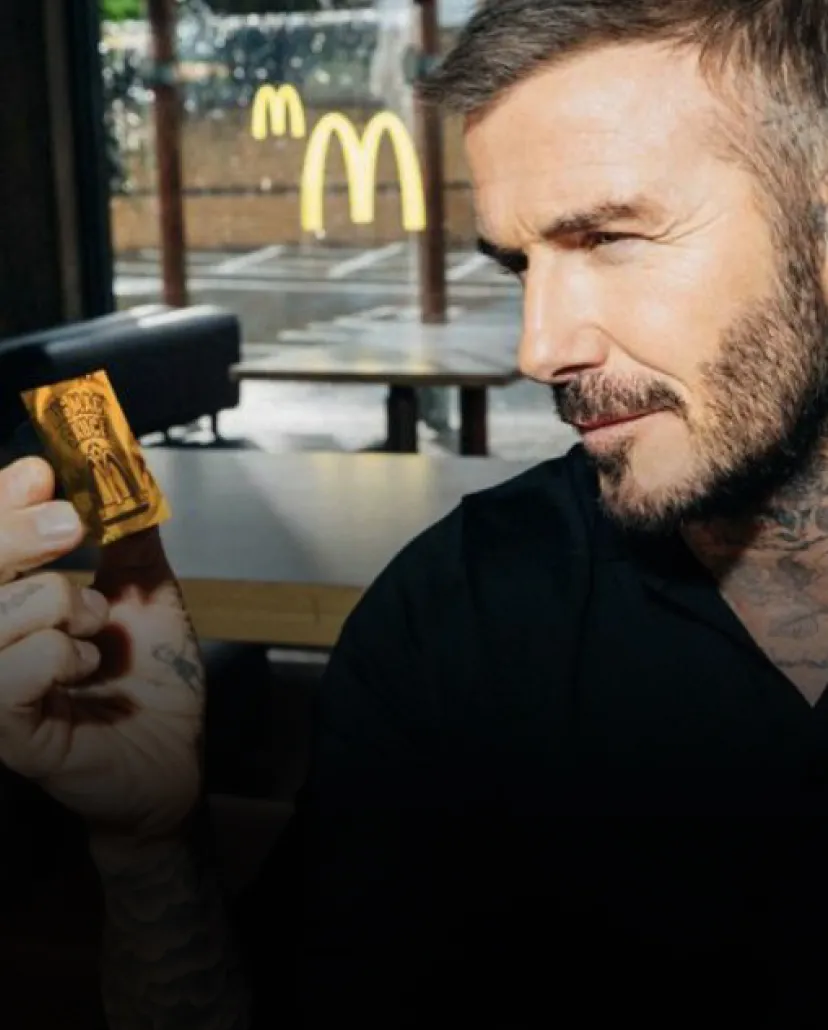 David Beckham gazing at Big Mac Sauce cup in his hand